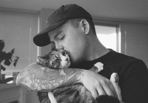 A landscape photo of Jordan and his cat Ava