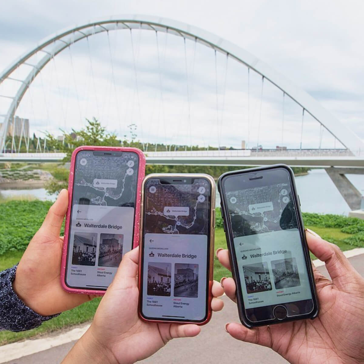 Three people out in Edmonton's river valley using the Commonwealth Walkway app