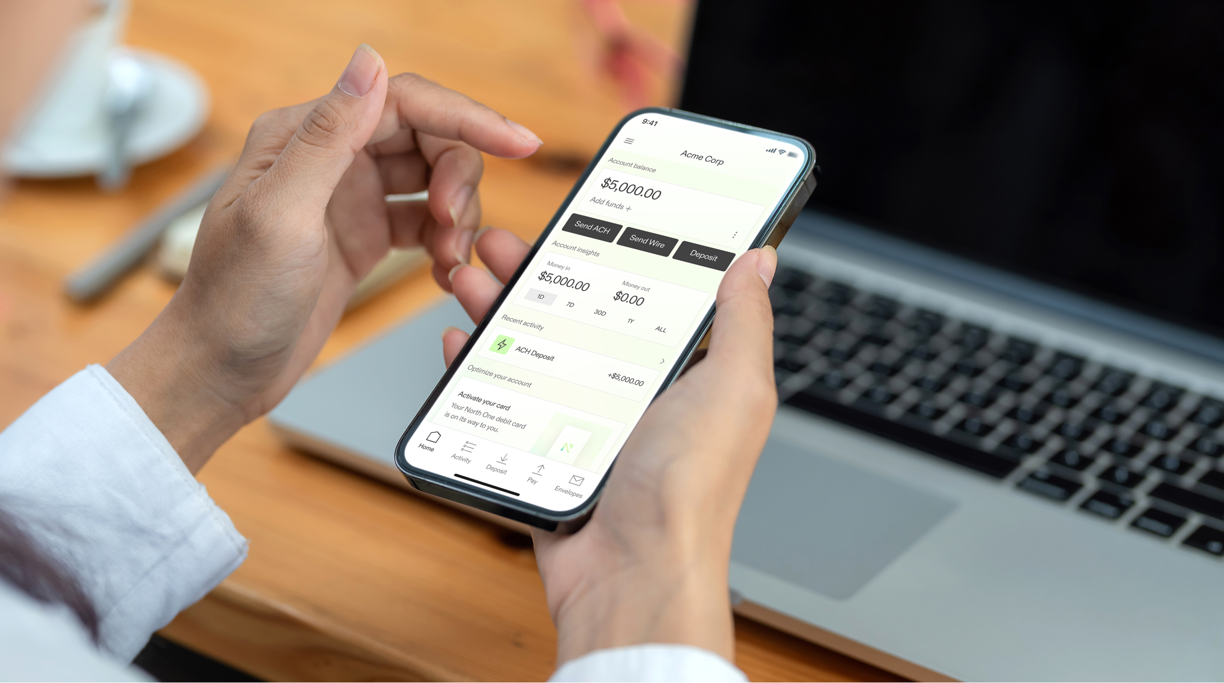 A photo of a North One customer online banking on their mobile device