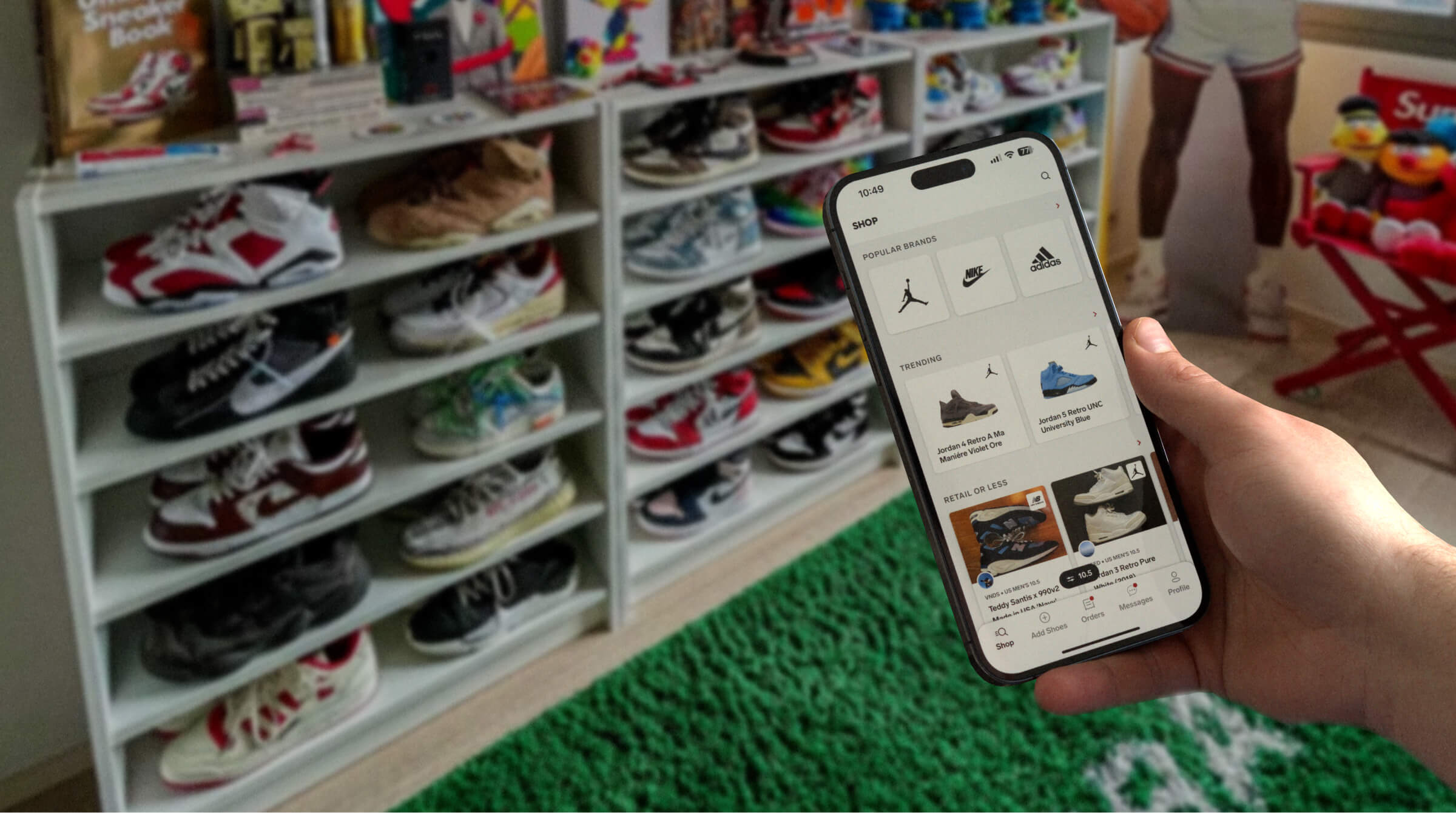 Image of a sneakerhead using the Collect mobile app in front of their sneaker collection
